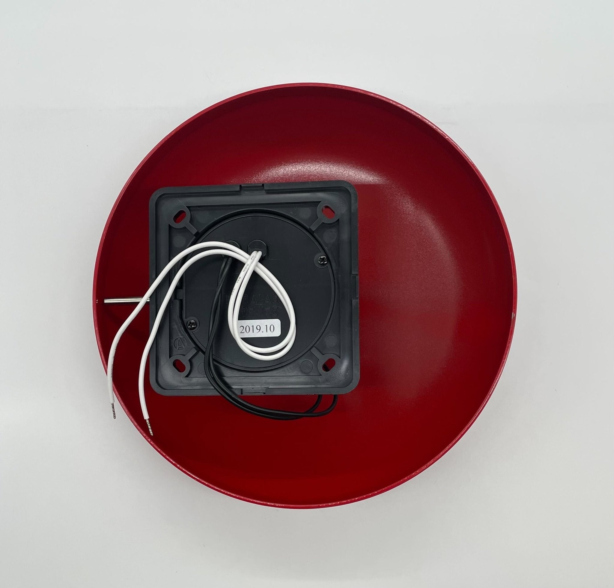 Gentex GB10-120 10-inch fire alarm bell mounted on wall, metal construction with mounting bracket, black finish, and brand label visible.