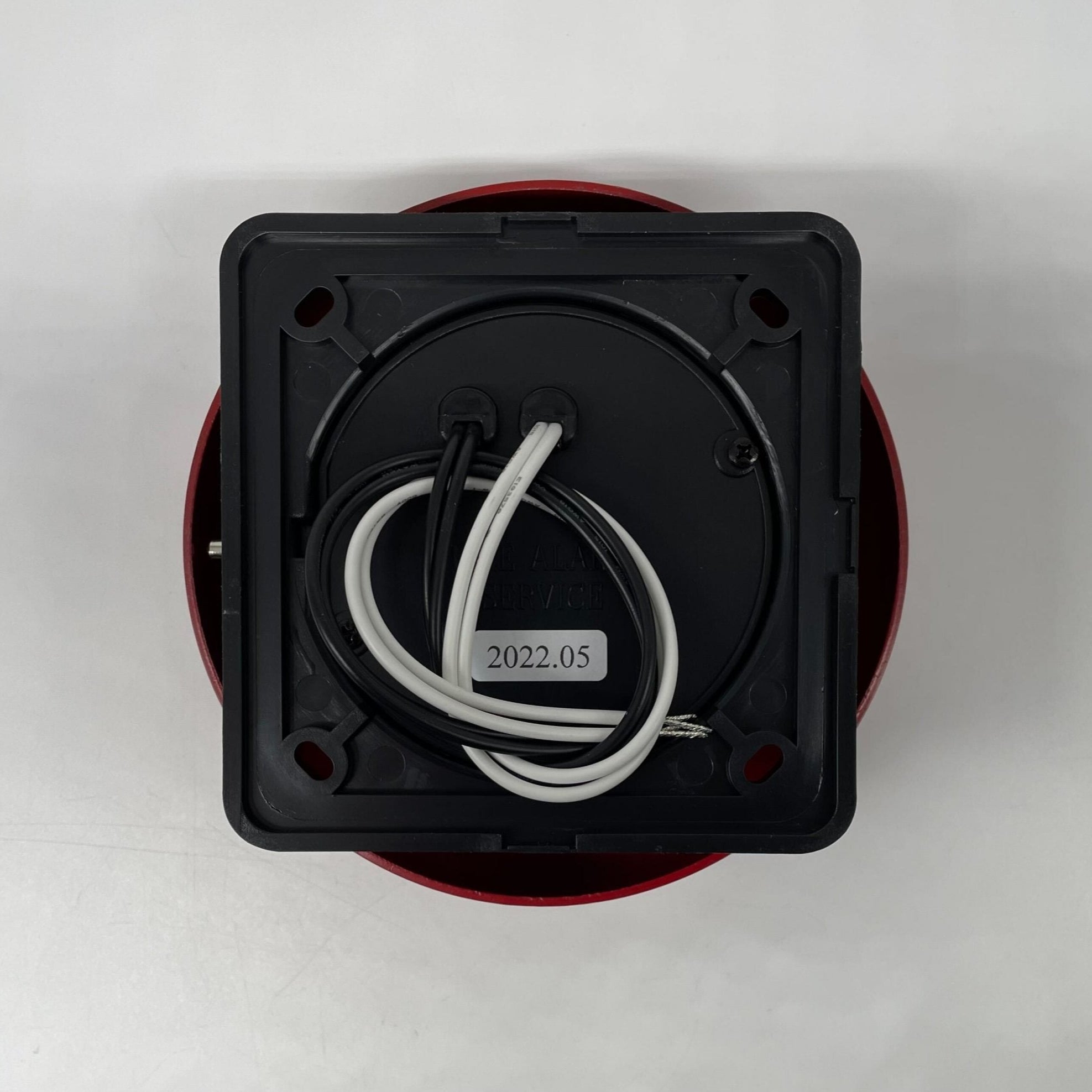 Gentex GB6-120 6-inch fire alarm bell mounted on wall, featuring metal casing and mounting bracket for fire safety alert.