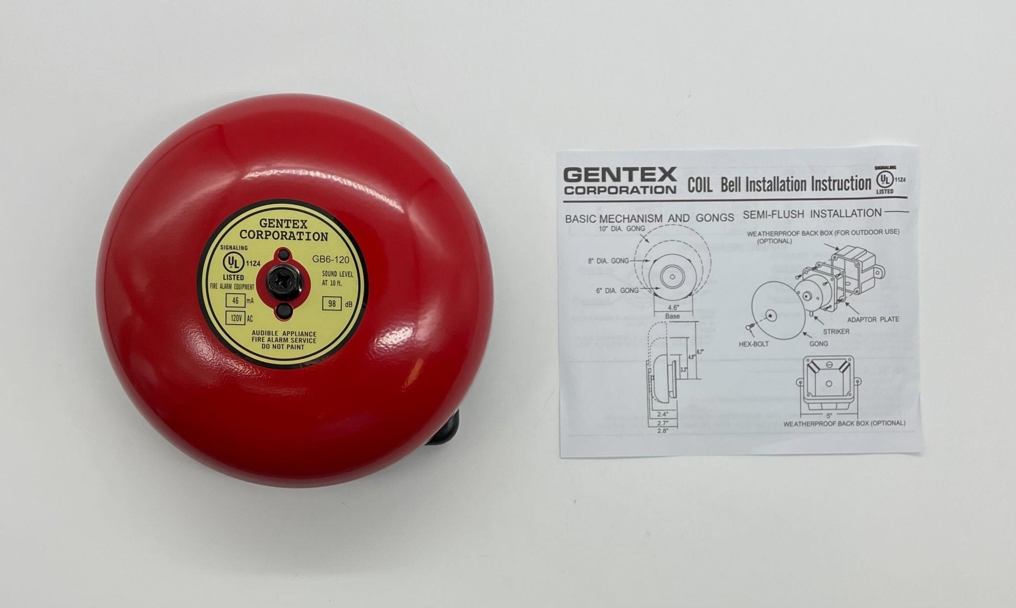 Gentex GB6-120 6-inch fire alarm bell with metal casing, mounted on a wall, designed for fire safety alert systems.