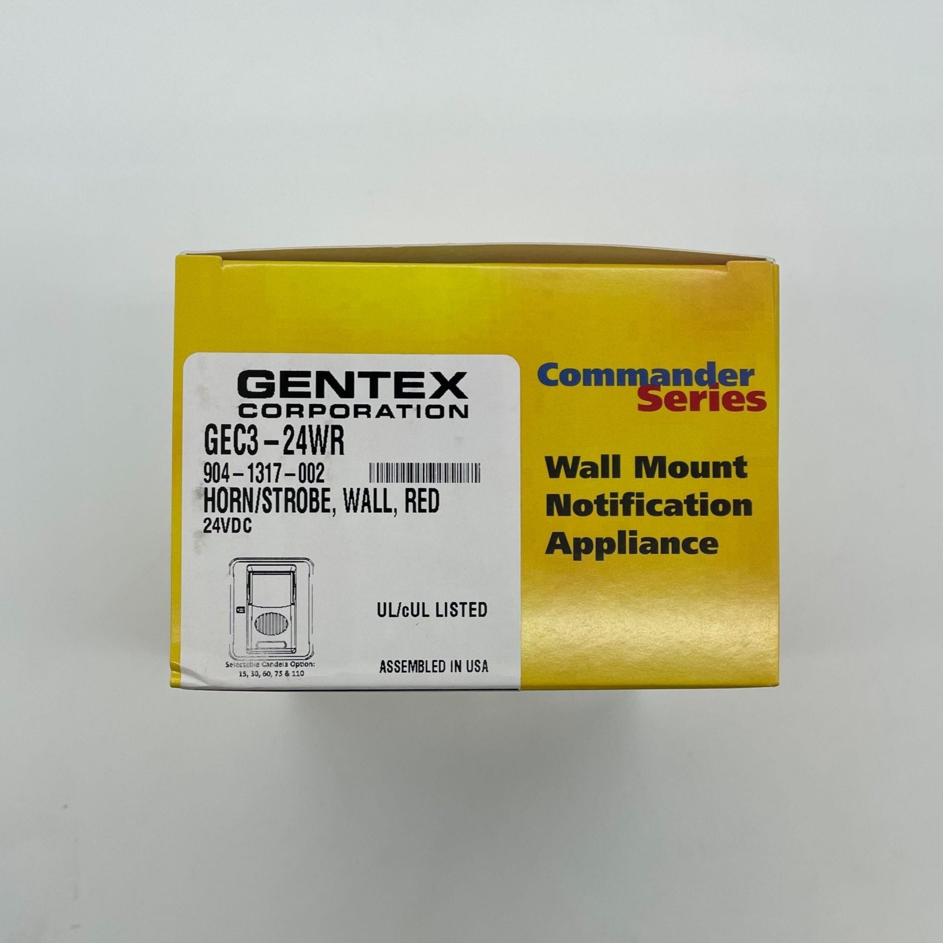 Gentex GEC3-24WR Horn Strobe alarm with red housing and clear lens, mounted on wall for fire safety alert system.