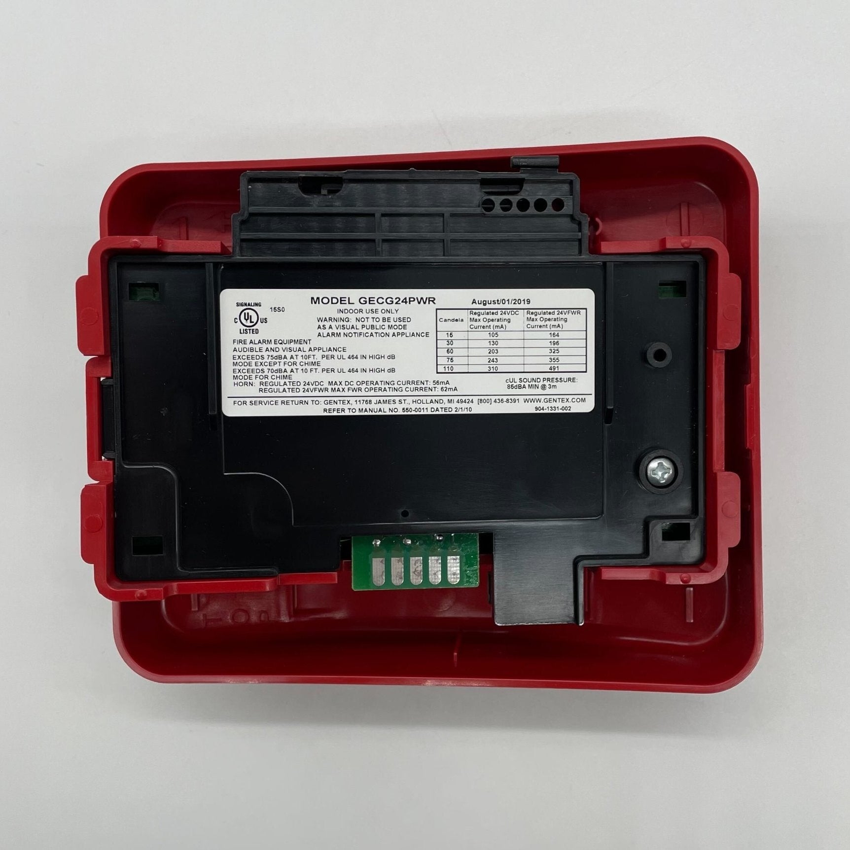 Gentex GECG24PWR horn strobe with green lens, fire alarm signaling device, mounted on wall, visible product details.