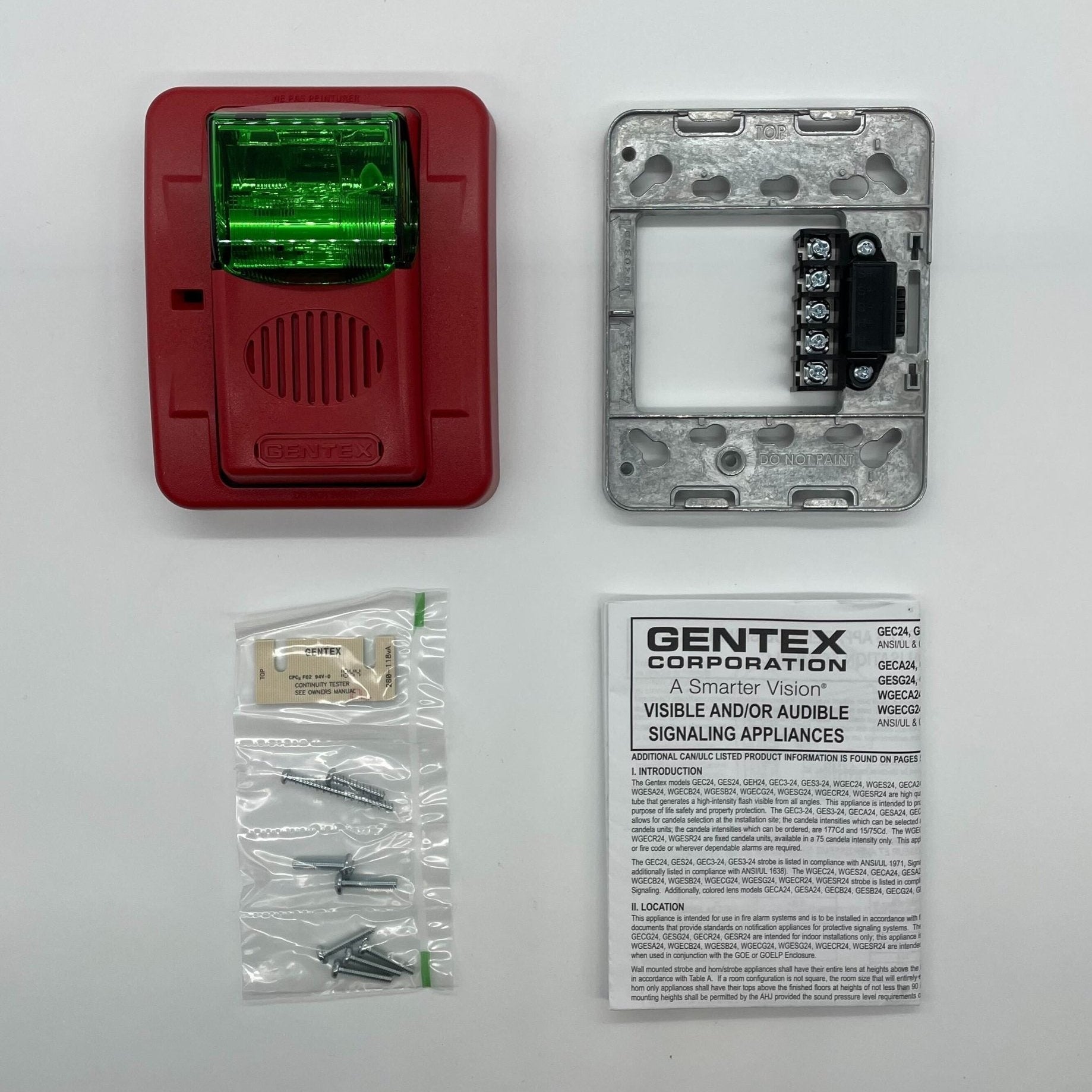 Gentex GECG24PWR horn strobe with green lens, visible mounting hardware, and clear lens details for fire alarm signaling.