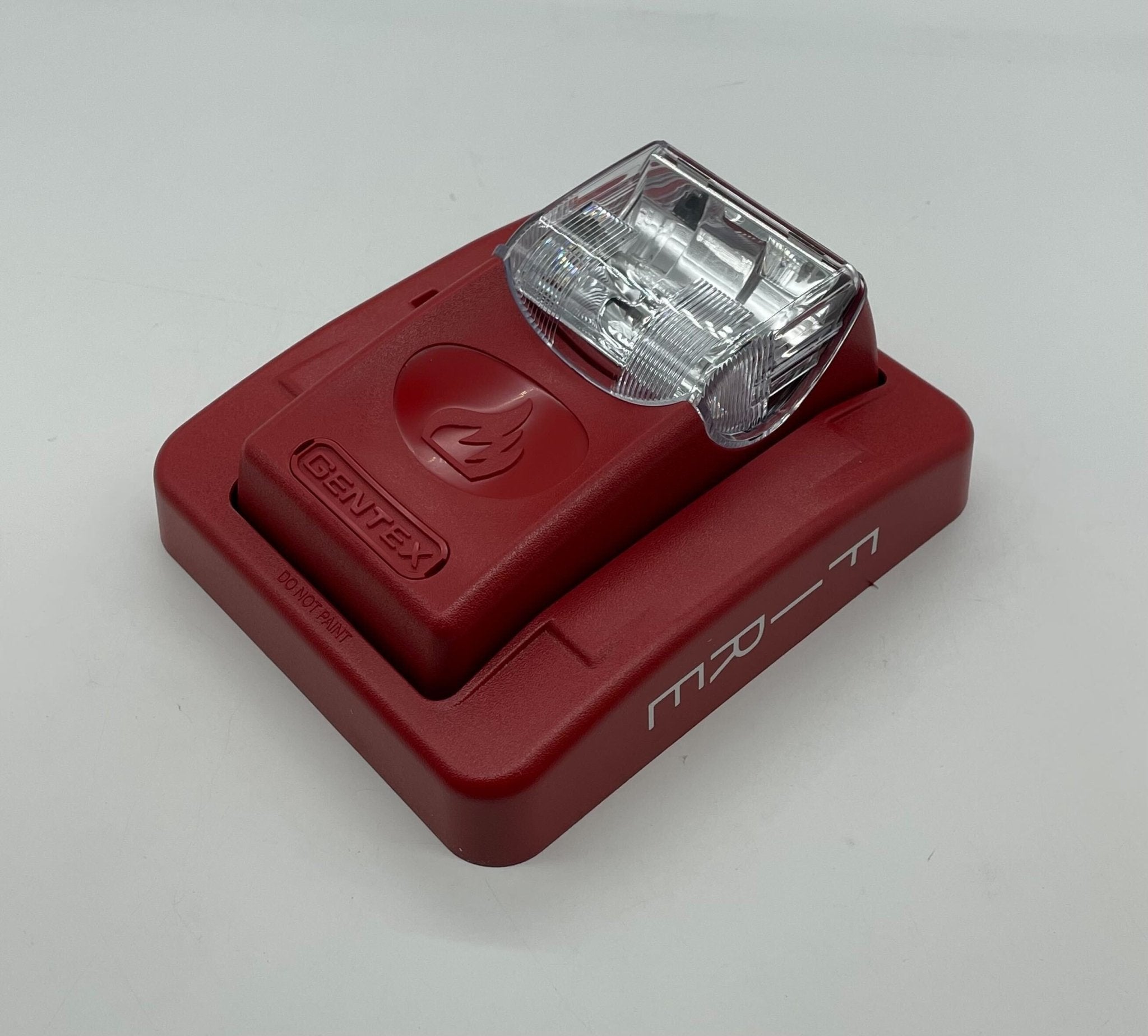 Gentex GES3-12WR strobe light with clear lens and mounting base, designed for emergency signaling and safety applications.