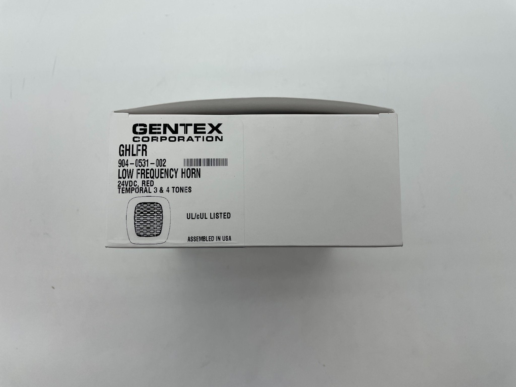 Gentex GHLFR horns, automotive safety horns with high-frequency sound, mounted on a vehicle in a professional setting.