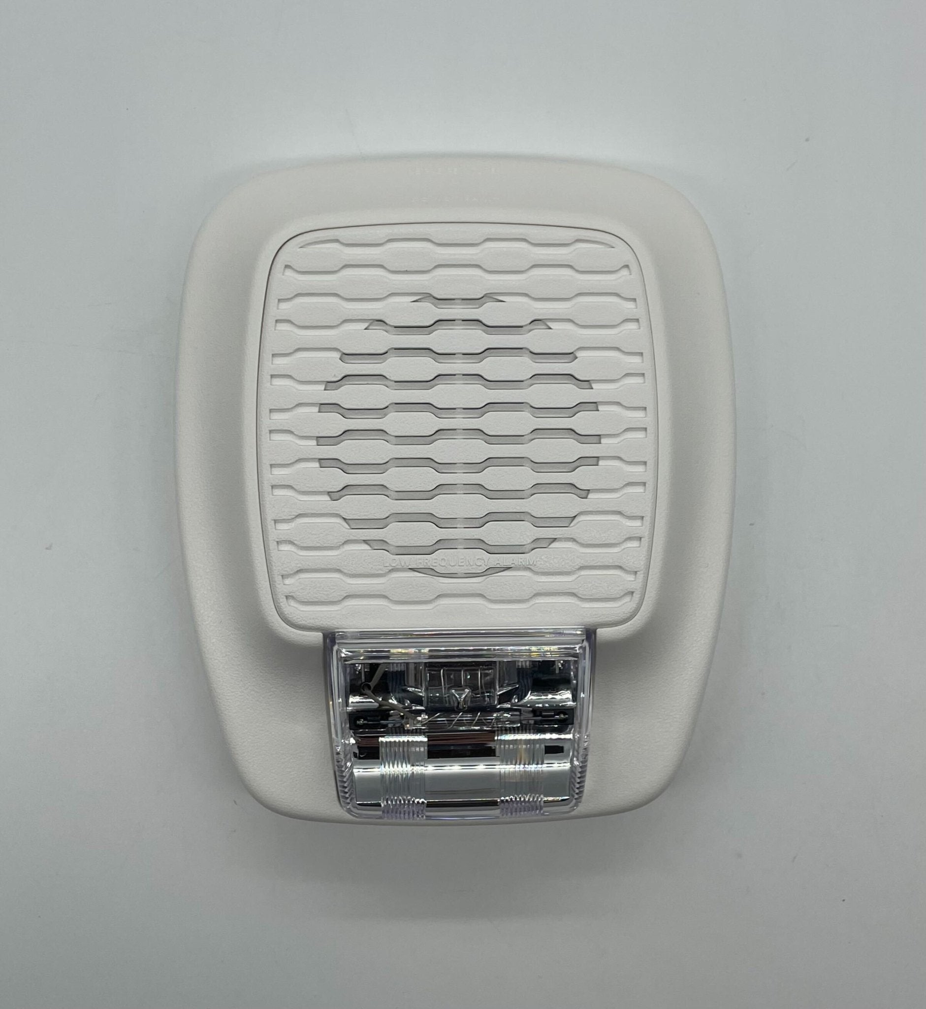 Gentex GHSLF177W horn strobe alarm with white housing and flashing light, designed for emergency alert systems.