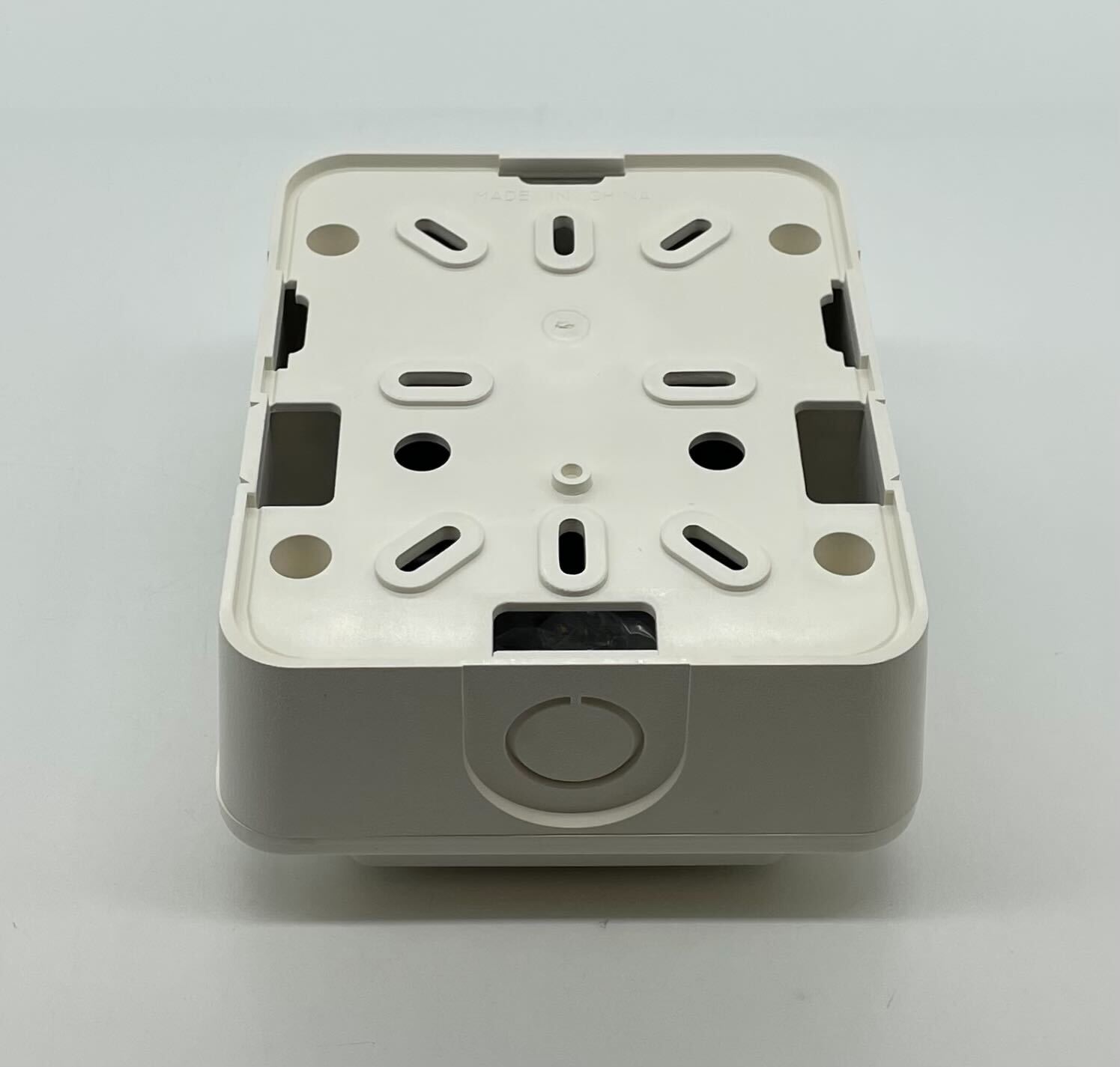 Gentex GTSM-W gangable synchronization module for alarm systems, shown mounted on a panel with wiring and connectors.