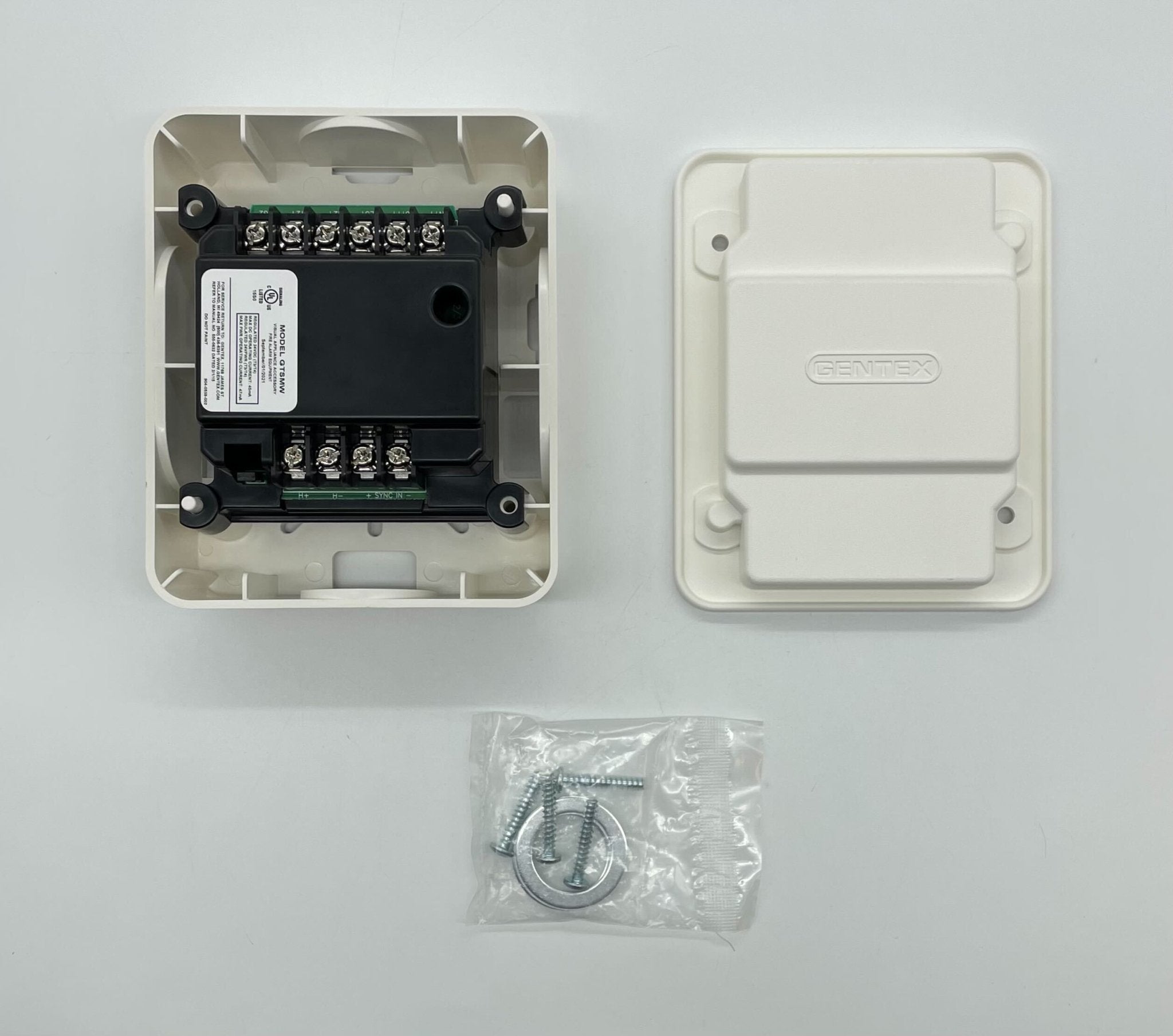 Gentex GTSM-W gangable synchronization module for fire alarm systems, shown in a close-up of the device with wiring details.