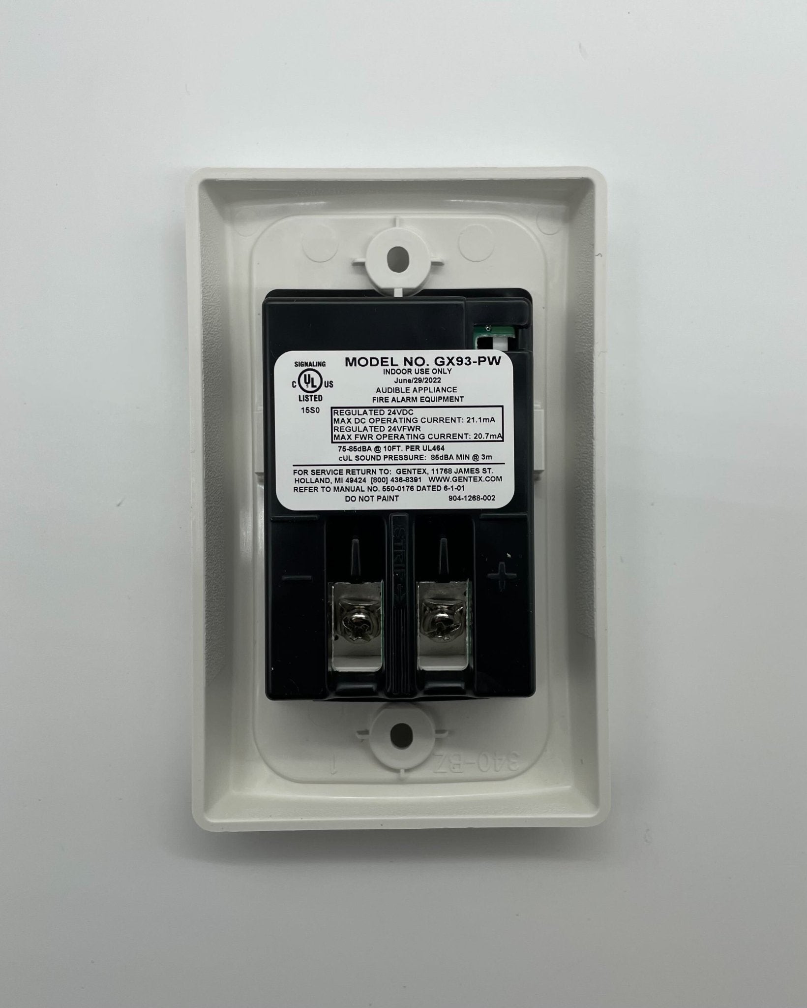 Gentex GX93-PW horns, industrial warning horns with black casing, mounted on a metal surface for vehicle or alarm systems.
