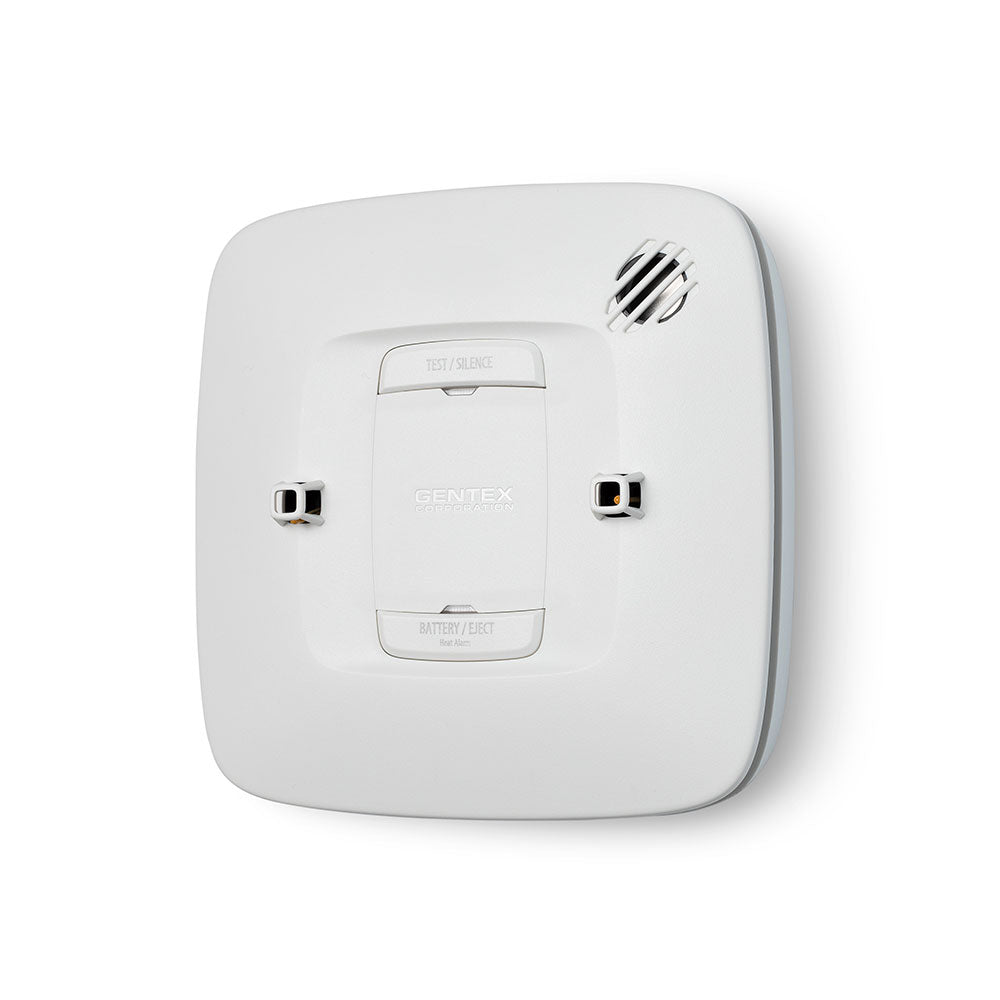 Gentex H Series Heat Alarm 120VAC, heat detector with white plastic casing and mounting bracket, used for fire safety.