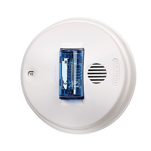 Gentex GCSB24PCW strobe light with white housing, mounted on a ceiling, designed for emergency visual signaling.