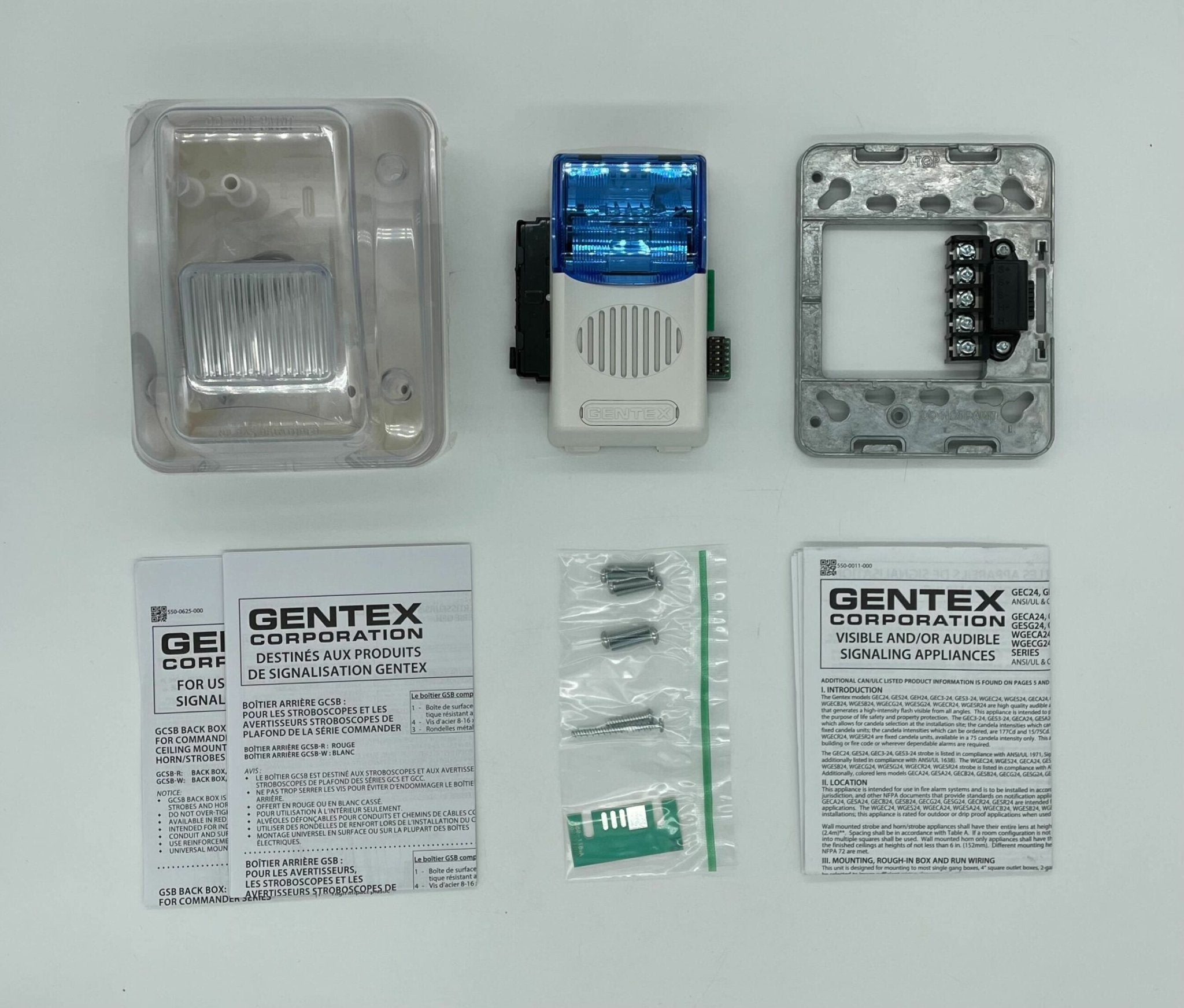 Gentex WGECB24-75PWW horn strobe alarm with white housing and red horn, mounted on a ceiling in a safety equipment setting.