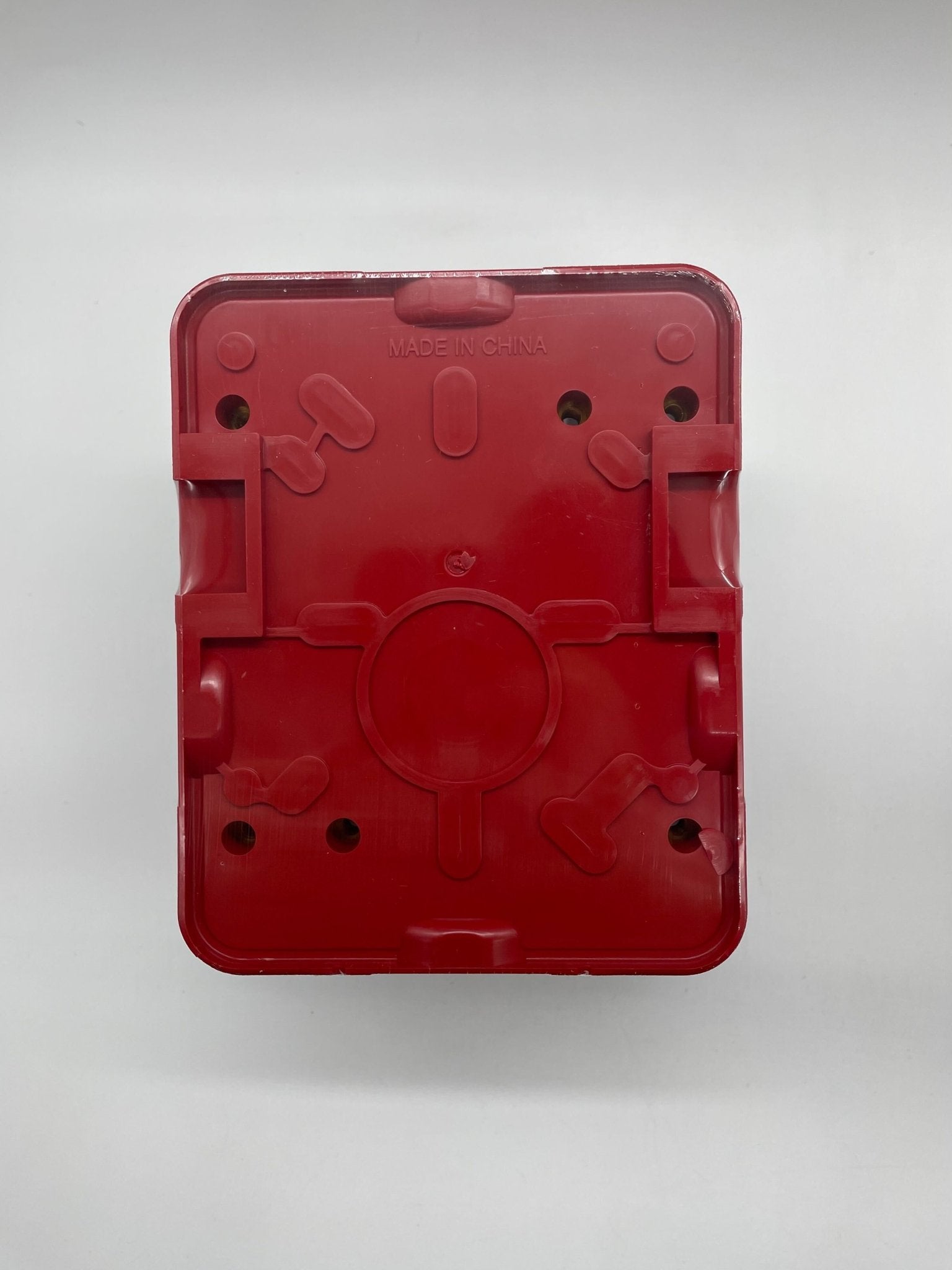 Gentex WGES24-75WR strobe light with clear lens and red warning light, mounted on ceiling for emergency signaling.