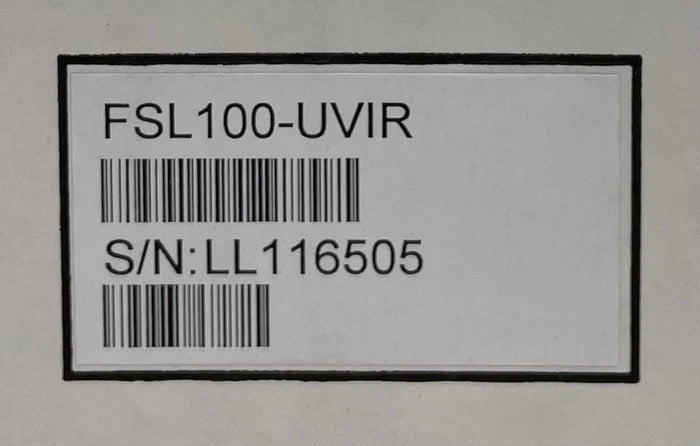 Honeywell FSL100-UVIR security sensor with UV and infrared detection, mounted on a wall for home or business security.
