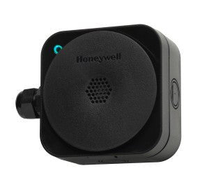 Honeywell SPLCF6BMRCXNZZ smart thermostat mounted on a wall in a modern home setting.