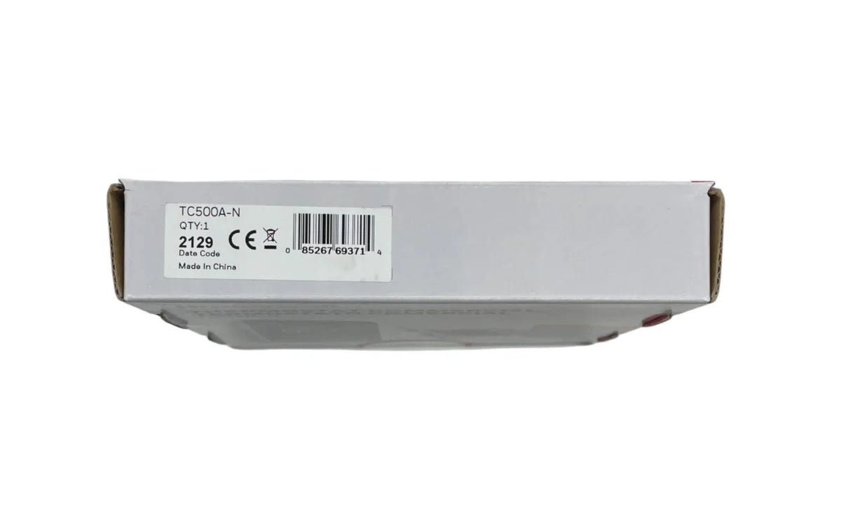 Honeywell TC500A-N commercial thermostat with digital display and control buttons, mounted on wall.