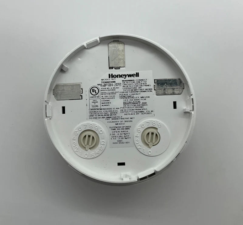 Honeywell TC840C3206 thermostat with digital display and control buttons, mounted on wall as part of a home heating system.