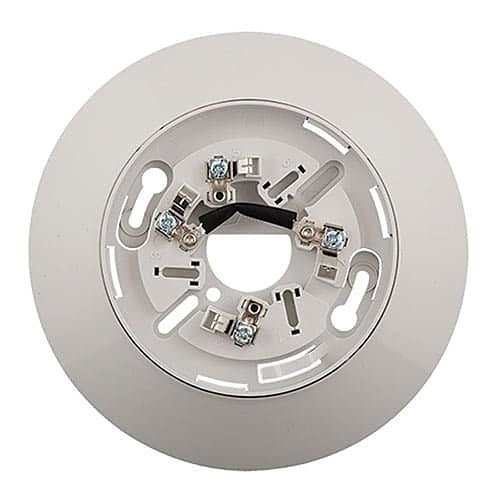 Kidde KI-SB smoke and carbon monoxide detector mounted on a ceiling, white plastic housing with electronic sensor components.