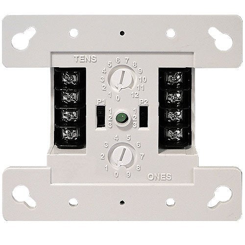 Kidde FX-IDC2B smoke detector mounted on ceiling, black and white design, with test and hush buttons visible.