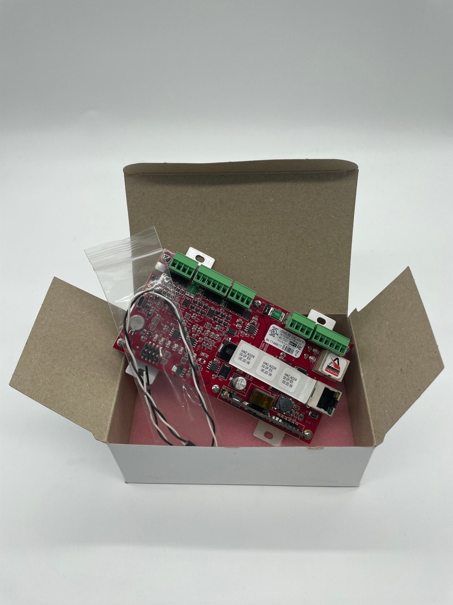 Lenel LNL-X2210 board, industrial control module with multiple ports, designed for security and access control systems.