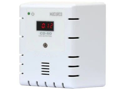 Macurco CD-6G gas detector sensor with digital display, mounted on a wall for industrial or commercial air quality monitoring.