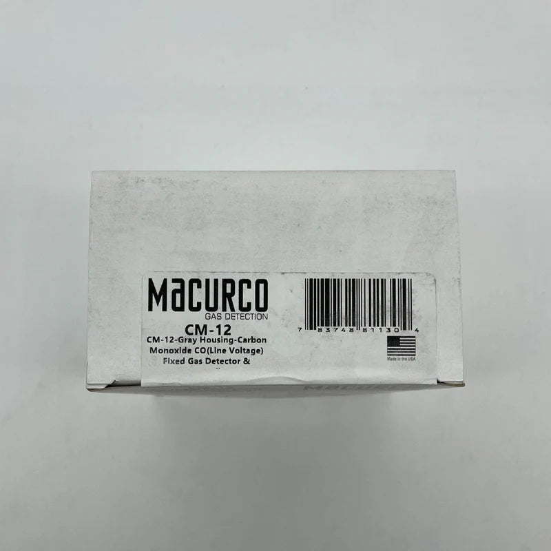Macurco CM-12 gas detector sensor with digital display and mounting bracket, used for indoor air quality monitoring.
