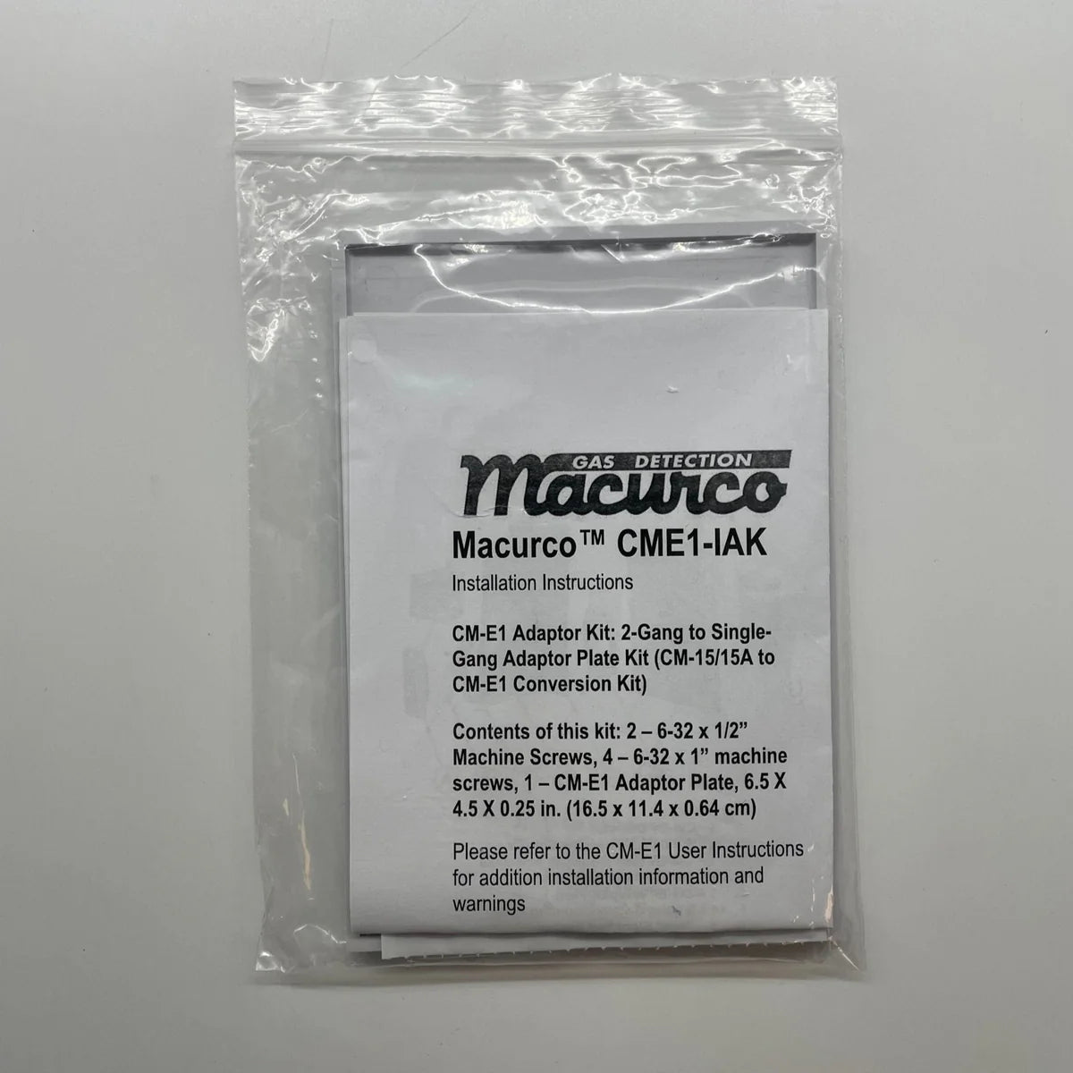 Macurco CM-E1-IAK gas detector with alarm, mounted on wall for indoor air quality monitoring and safety.