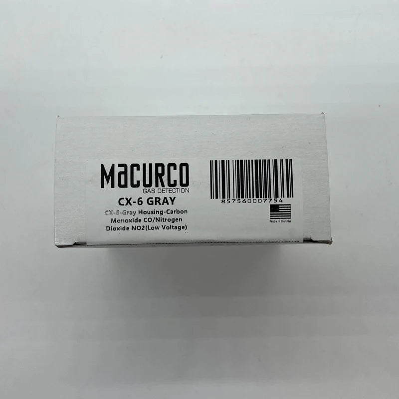 Macurco CX-6 gas detector sensor with digital display and control panel for indoor air quality monitoring.