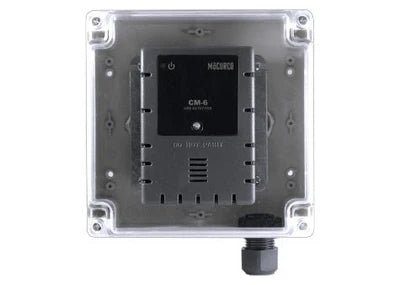 Macurco DMK-1 gas detector with digital display, mounted on wall for indoor air quality monitoring and safety.