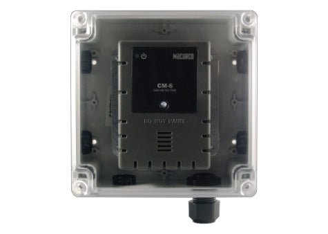 Macurco WHK-1 gas detector installed on wall, compact black sensor for detecting hazardous gases in industrial or commercial settings