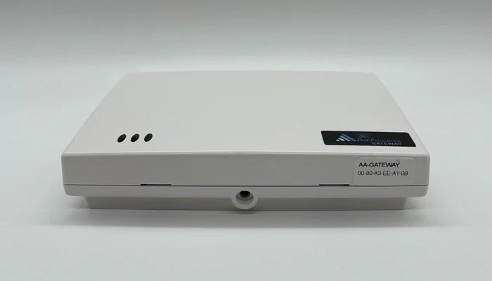 Napco AA-KIT1A security alarm system kit with control panel and accessories, installed in a home security setup.