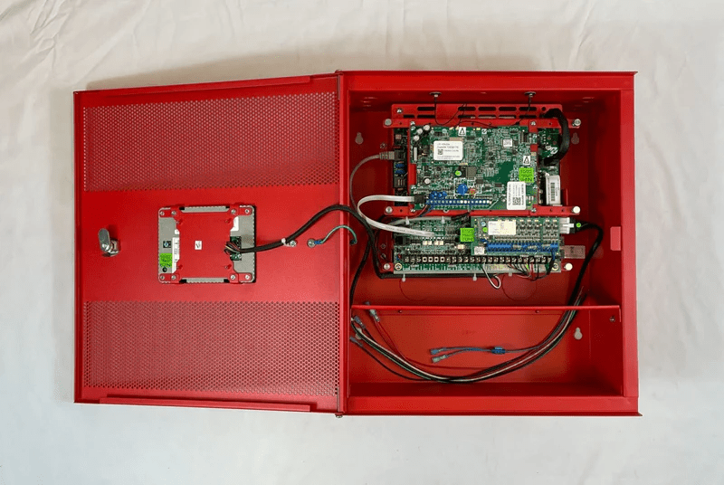 Napco FL-32FACP-LTEVS security alarm panel with keypad and display, designed for home security systems.