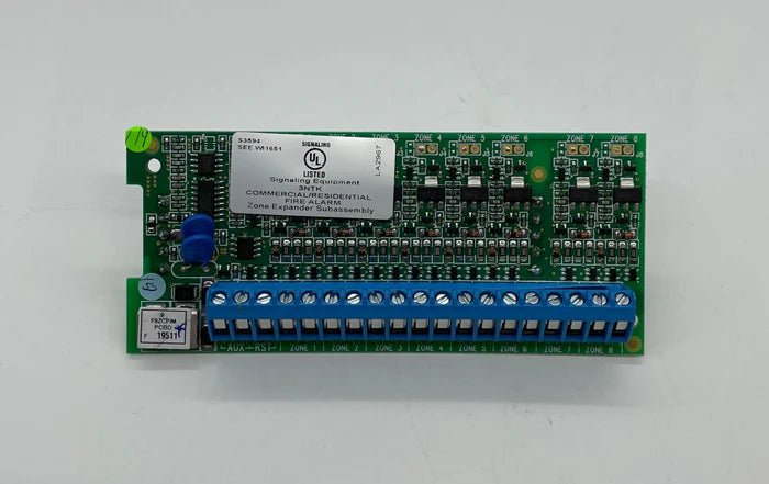 Napco GEMC-F8ZCPIM security system control panel with keypad and wiring connections, installed on a wall.