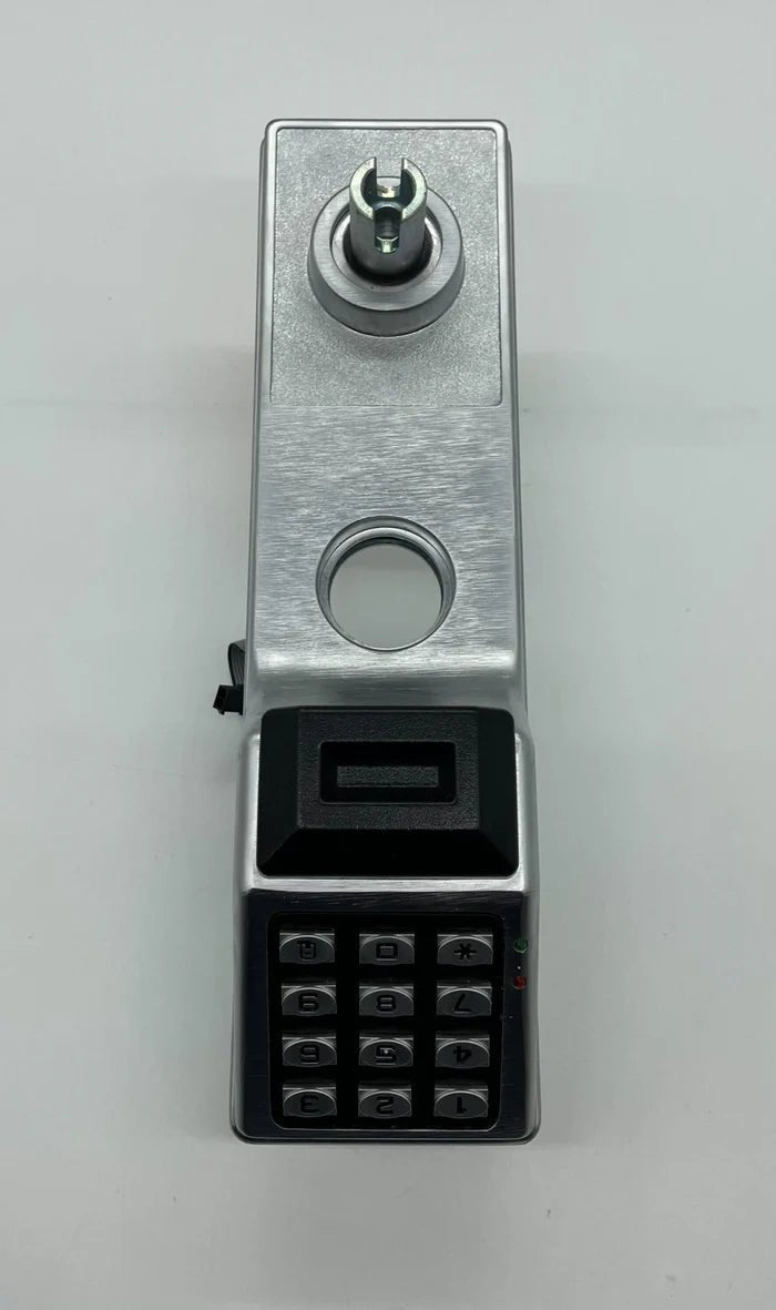 Napco PDL6600CRL/26D digital lock with keypad and key access, installed on a modern door for security.