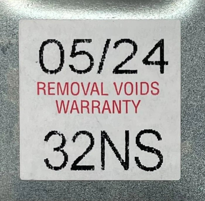 Napco PDL6600CRR/26D security alarm keypad with red and black buttons, mounted on a wall.