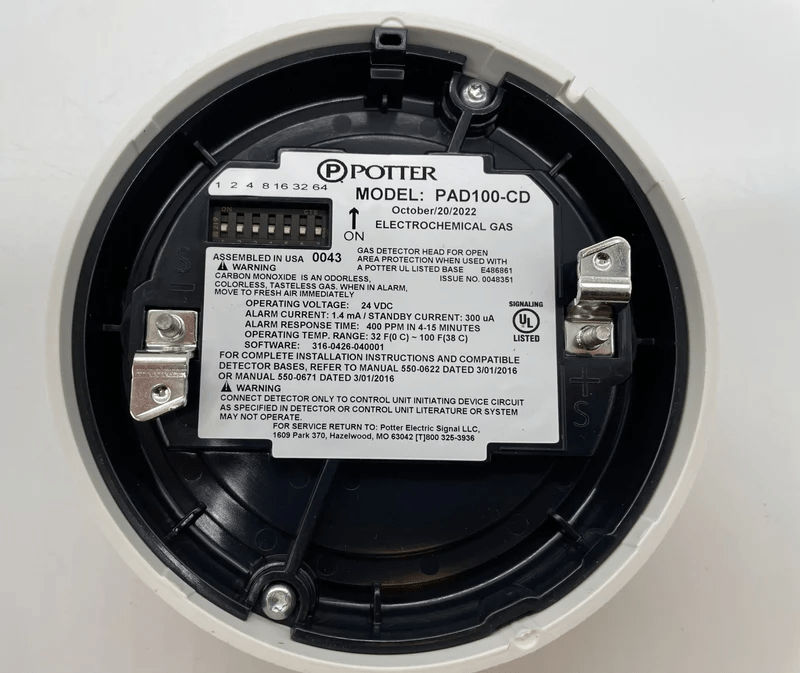 Potter PAD100-CD electronic device with control panel and display, used for industrial or technical applications.