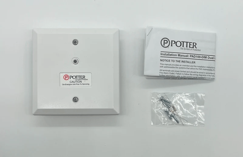 Potter PAD100-DIM dimmer switch with control knob, mounted on a wall, showcasing its sleek design and adjustable lighting control.