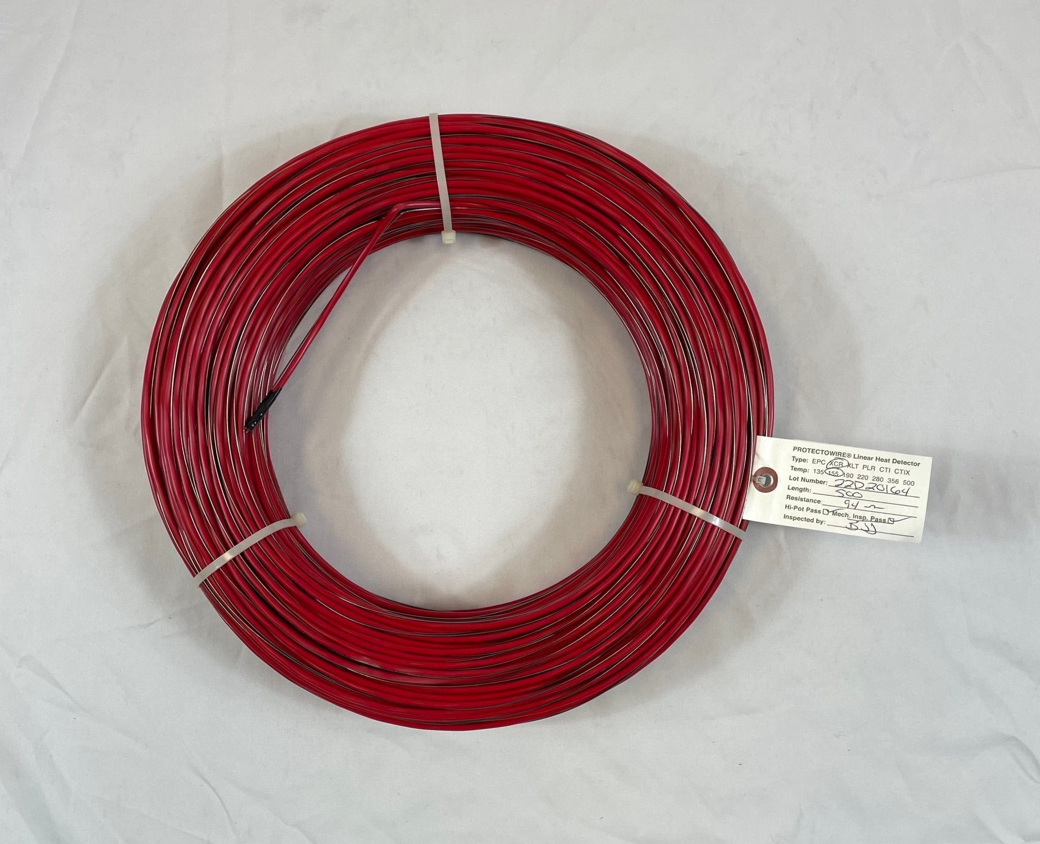 Protectowire PHSC-155-XCR-M linear heat detection cable installed in electrical panel for fire safety monitoring.