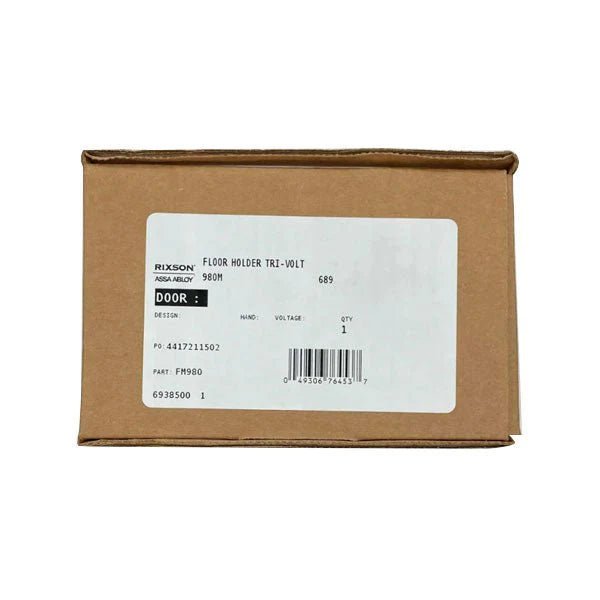 Rixson FM980 low profile electromagnetic door holder mounted on a door frame, designed for secure hold open and release.