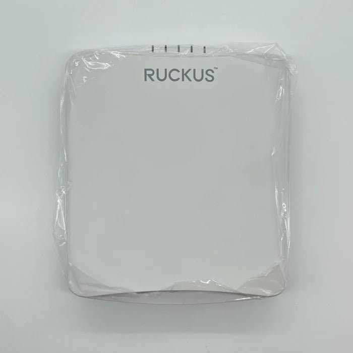 Ruckus R650 Wi-Fi access point mounted on a wall, showing its sleek design and multiple antenna ports for enterprise networking.