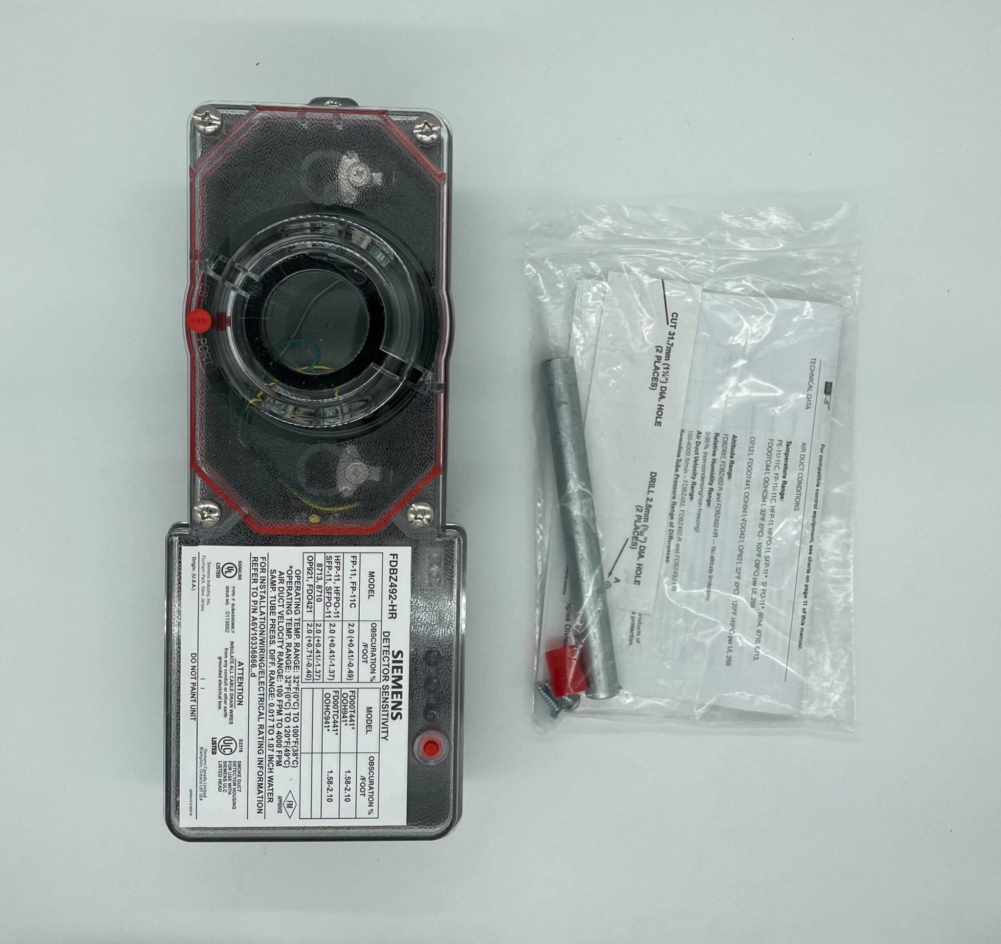 Siemens FDBZ492-HR duct detector installed in HVAC system, showing sensor and wiring for smoke or fire detection.