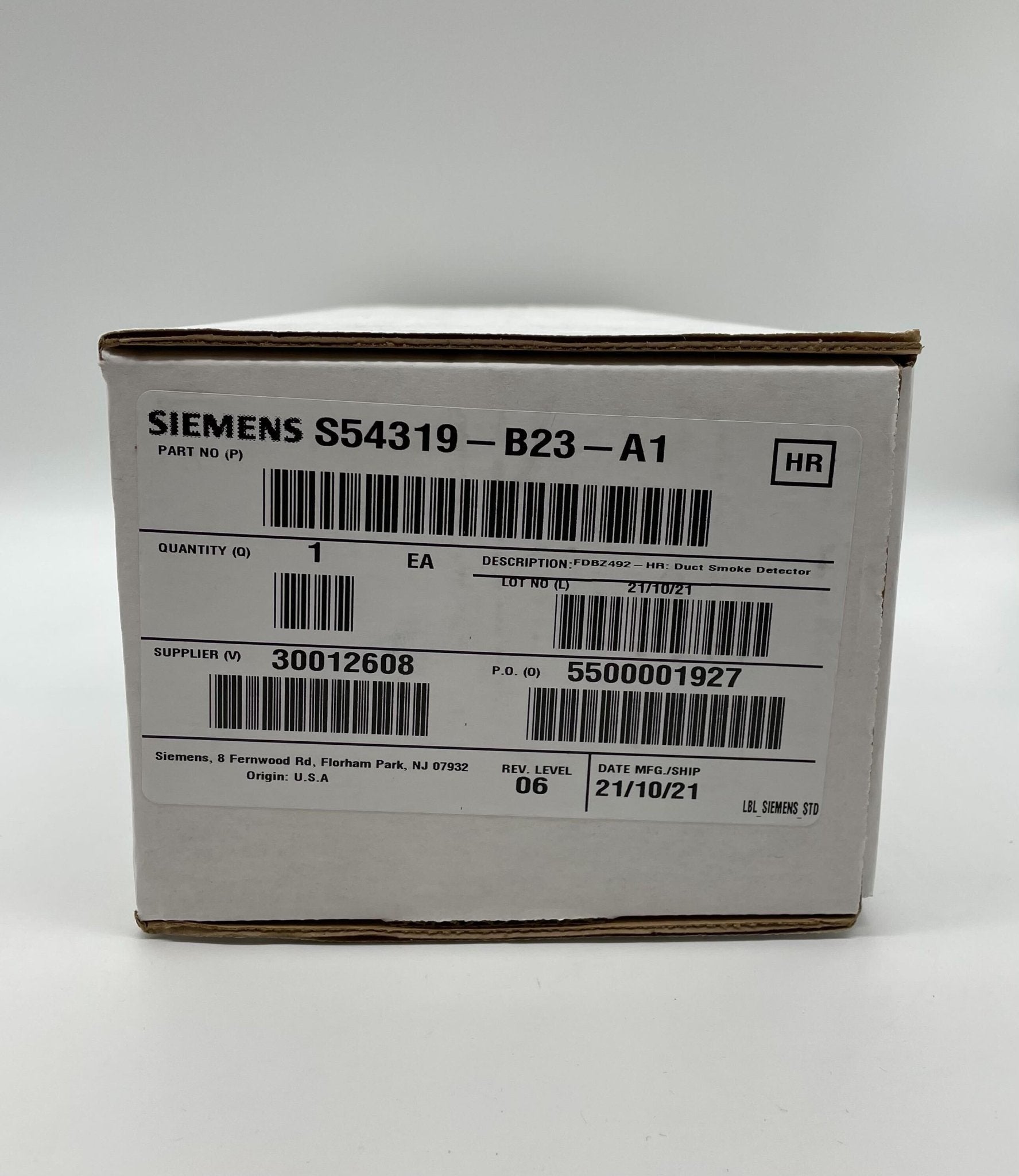 Siemens FDBZ492-HR duct detector installed in HVAC system, showing compact design and sensor components for airflow monitoring.
