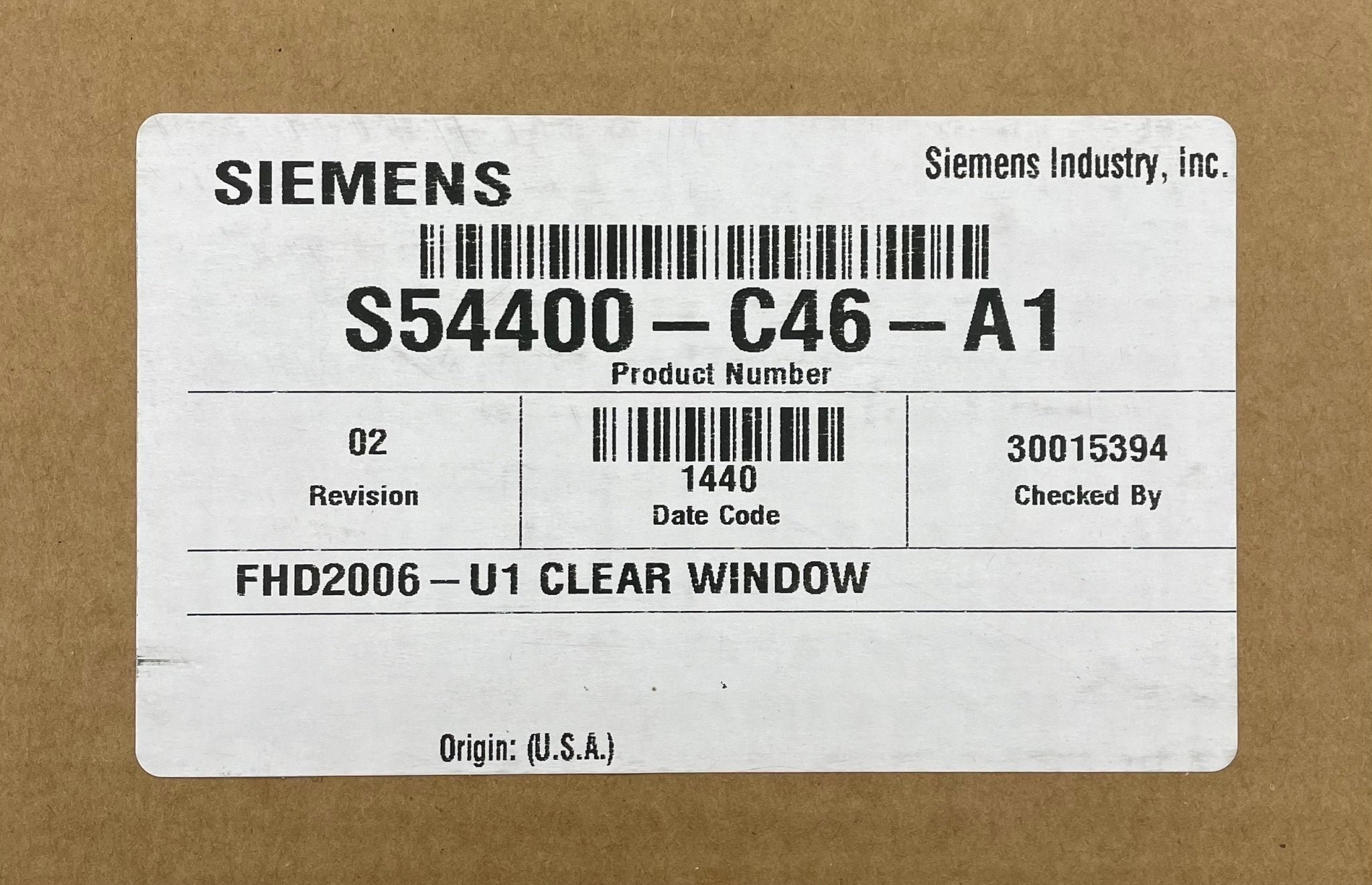 Siemens FHD2006-U1 fire alarm device with smoke and heat detection sensors, mounted on a wall.