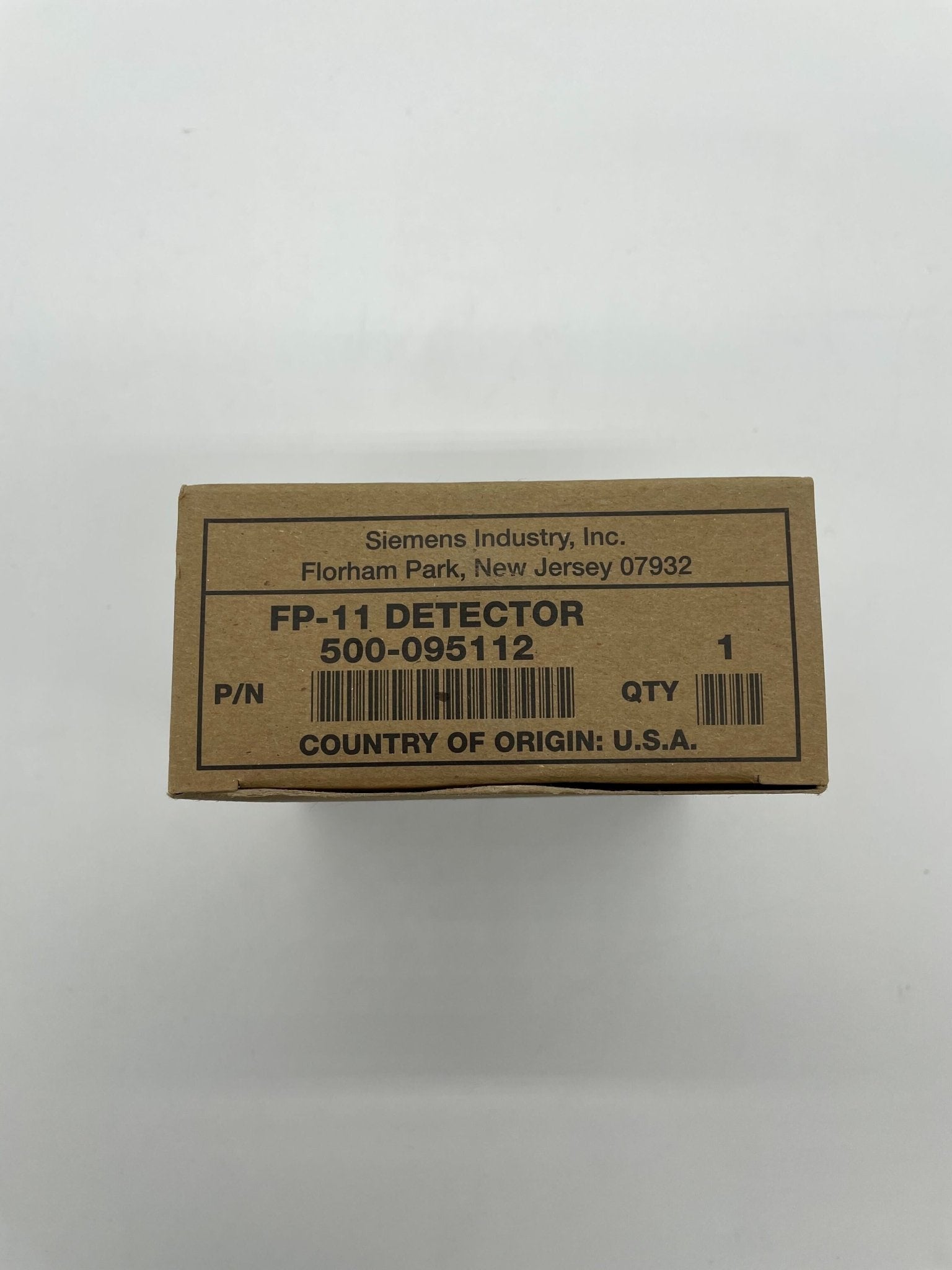 Siemens FP-11 heat detector installed on ceiling, electronic safety device for fire detection and prevention.