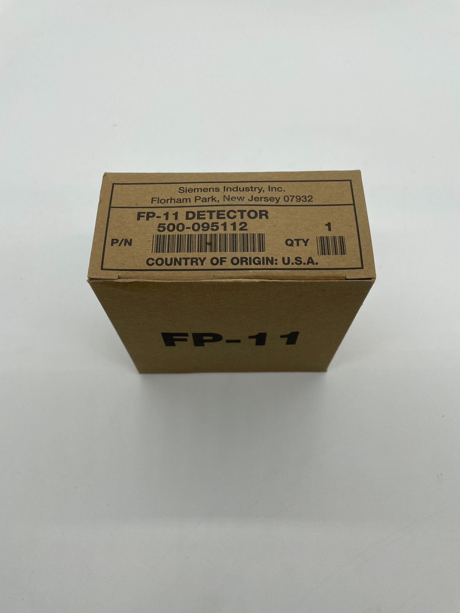 Siemens FP-11 heat detector mounted on ceiling, designed for fire detection and safety in commercial or residential buildings