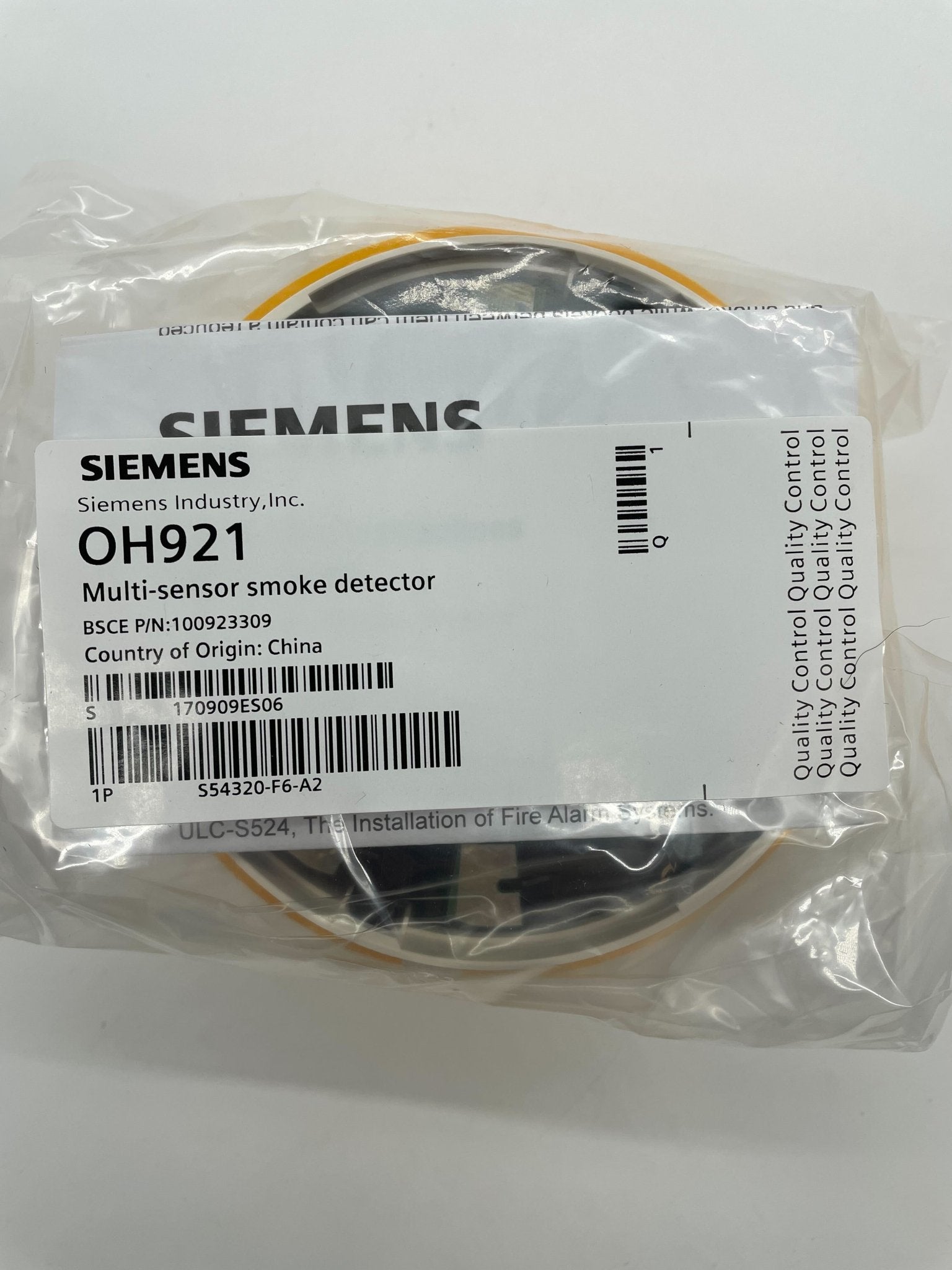 Siemens OH921 fire alarm with digital display and sensor, mounted on wall, designed for residential or commercial safety.