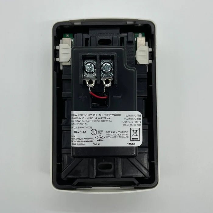 Siemens SLHSWW-F smart home switch with sleek white design, mounted on a wall with a modern living room background