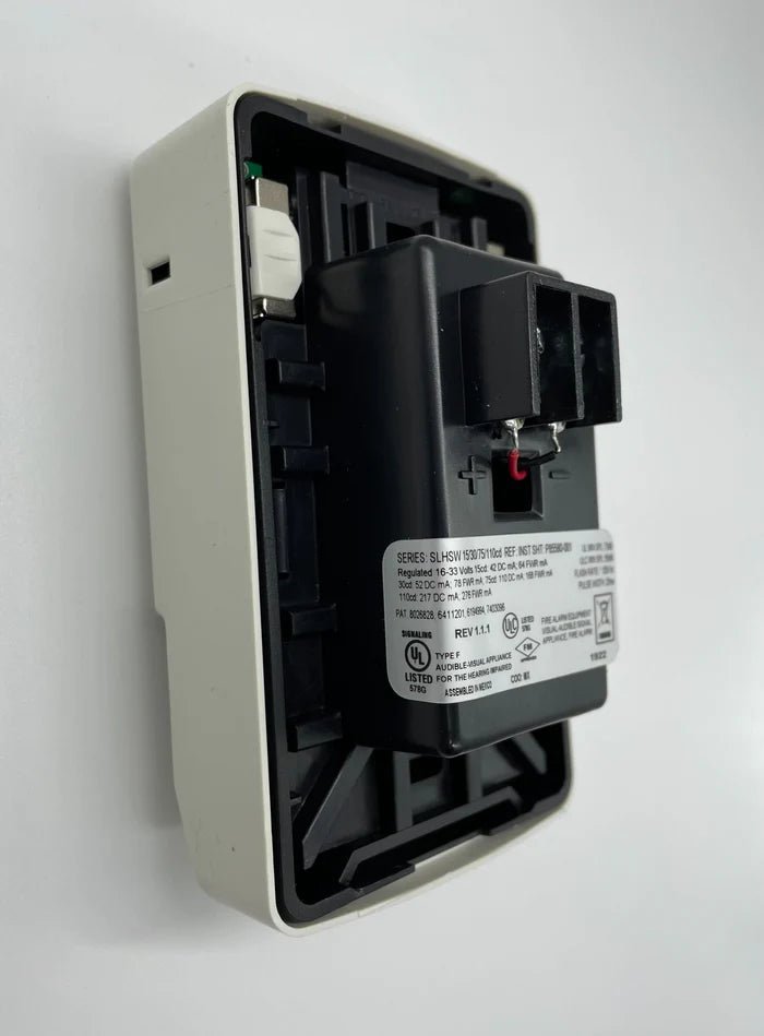Siemens SLHSWW-F smart home system controller mounted on wall with digital display and interface for home automation.