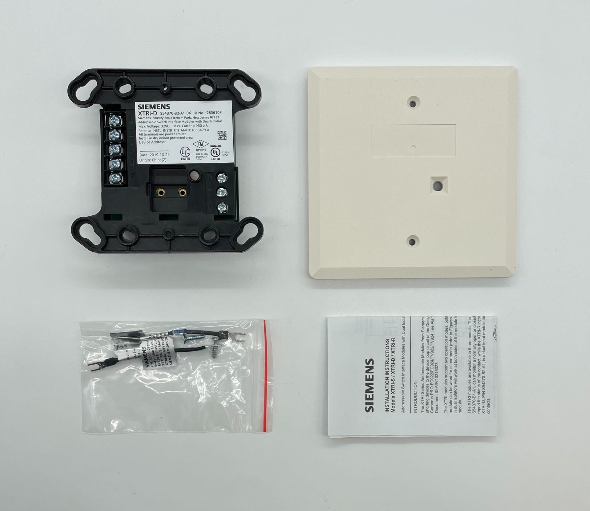 Siemens XTRI-D fire alarm with multiple sensors and wiring connections, mounted on a wall for fire safety detection.