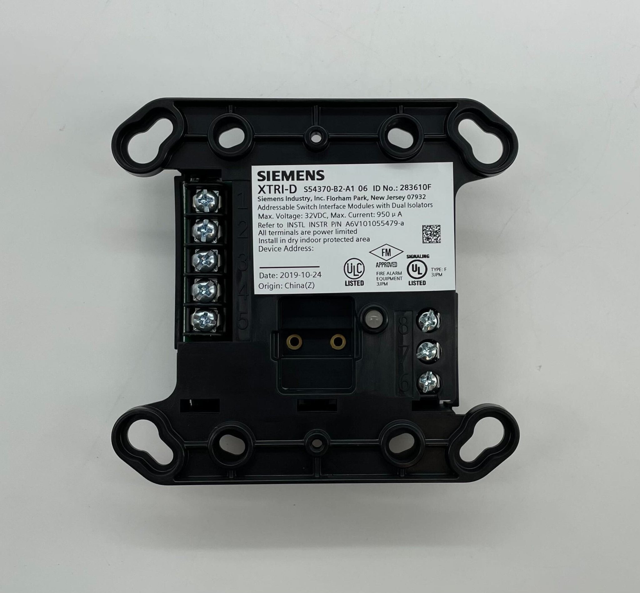 Siemens XTRI-D fire alarm system with multiple detectors and control modules installed in a building ceiling.