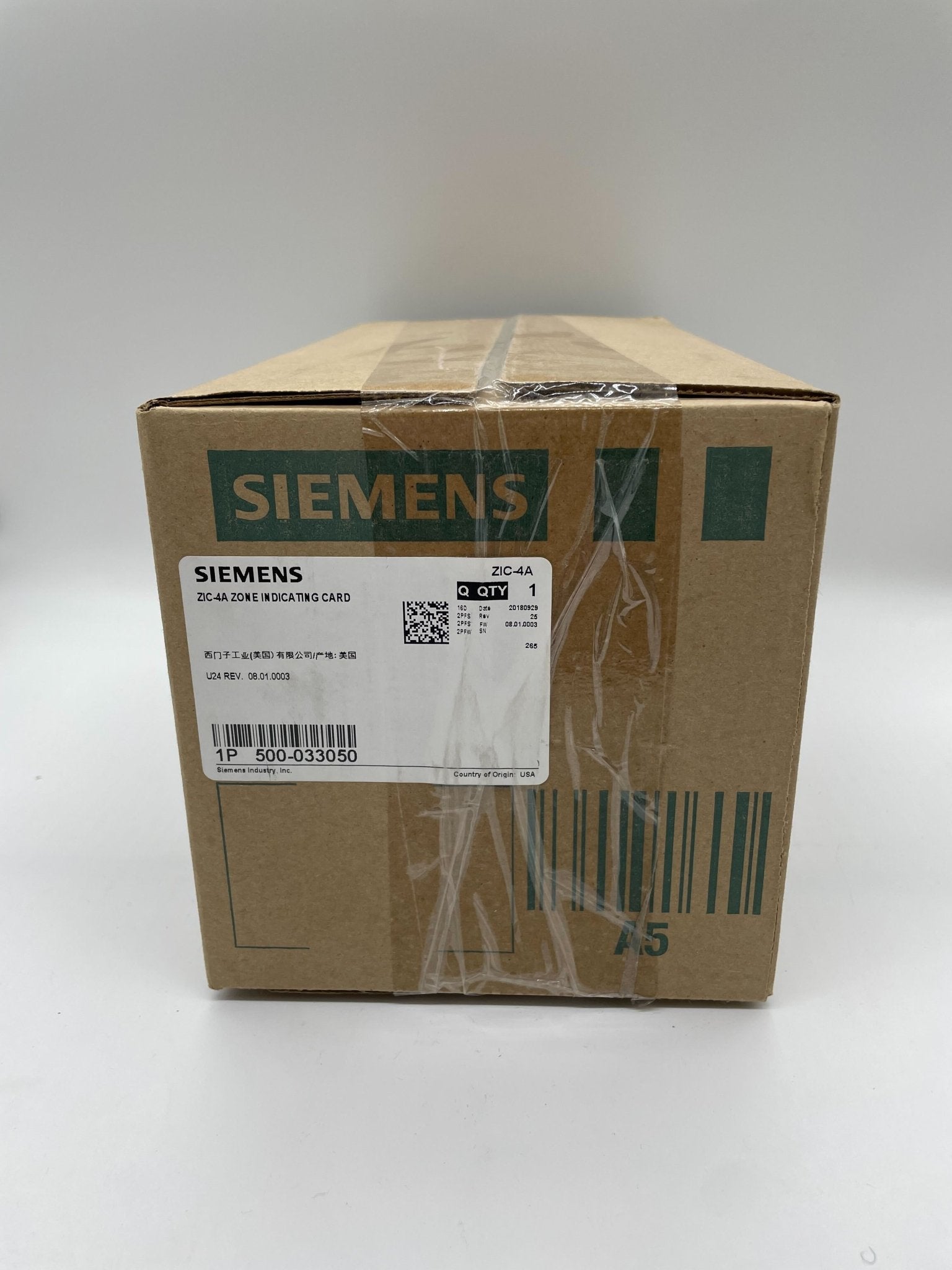 Siemens ZIC-4A NAC module, black rectangular electronic device with multiple ports and connectors on the front.